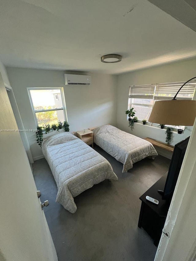 bedroom with an AC wall unit