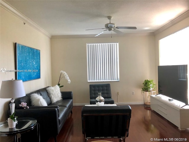 living room with crown molding, dark hardwood / wood-style flooring, and ceiling fan