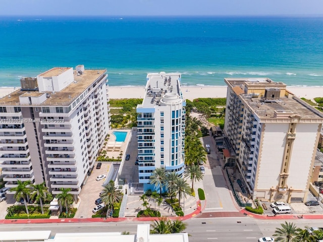 aerial view featuring a view of the beach and a water view