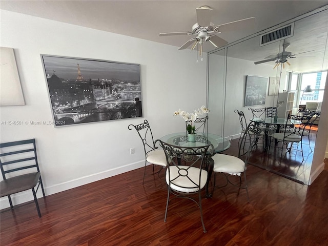 dining room with ceiling fan and dark hardwood / wood-style floors