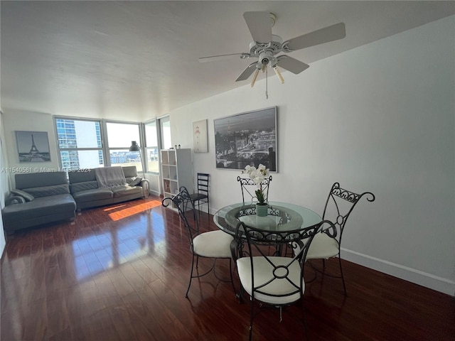 dining area featuring dark hardwood / wood-style floors and ceiling fan