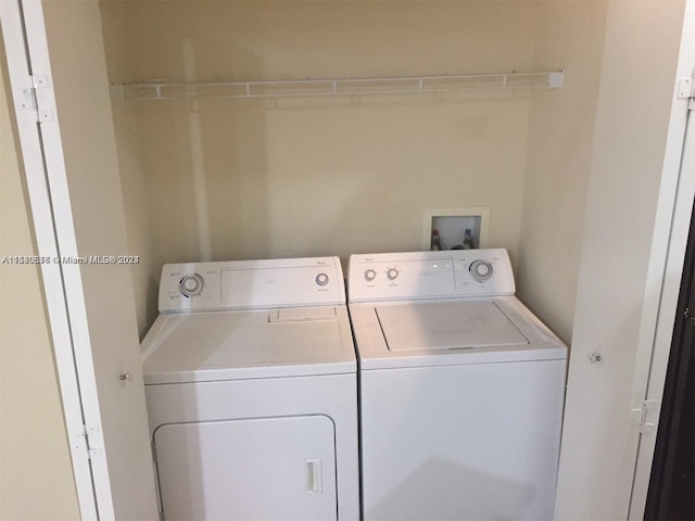 laundry area with hookup for a washing machine and separate washer and dryer