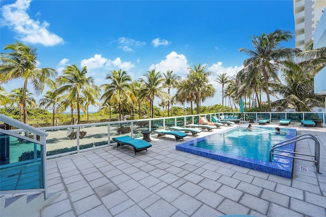 view of swimming pool with a patio area