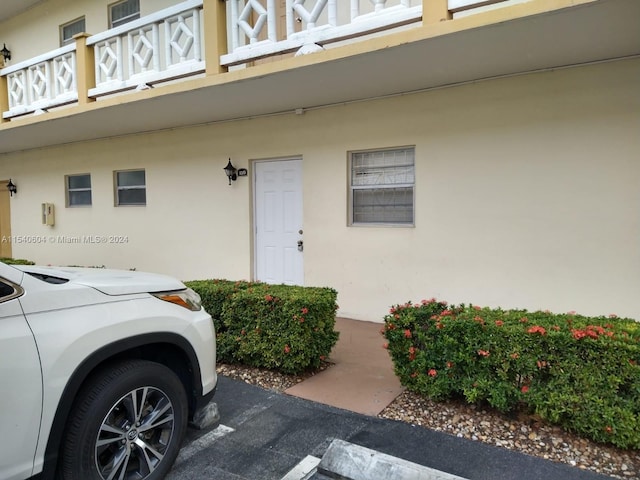 doorway to property featuring a balcony