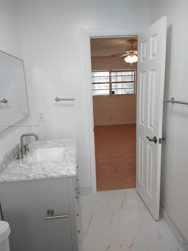 bathroom featuring vanity and ceiling fan