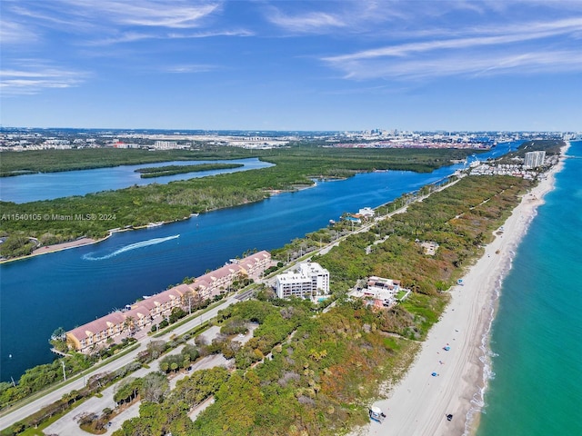 birds eye view of property featuring a water view and a view of the beach