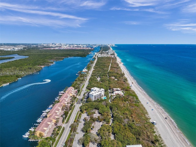 birds eye view of property with a view of the beach and a water view