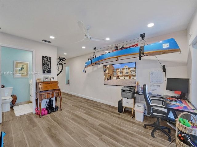 office featuring ceiling fan and light hardwood / wood-style flooring