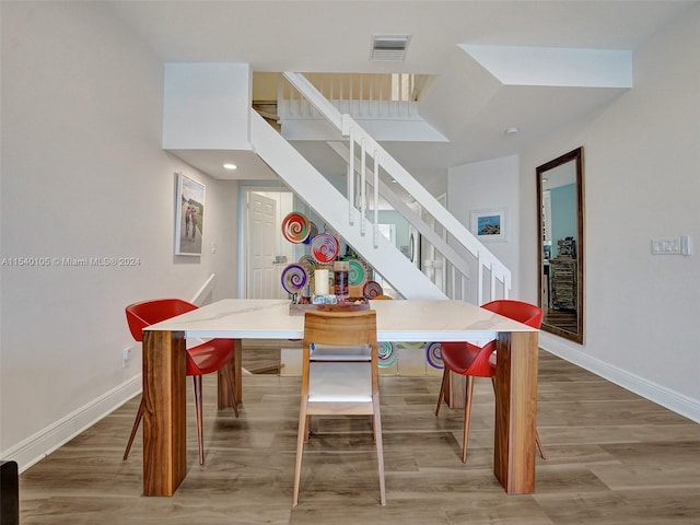 dining space featuring hardwood / wood-style flooring