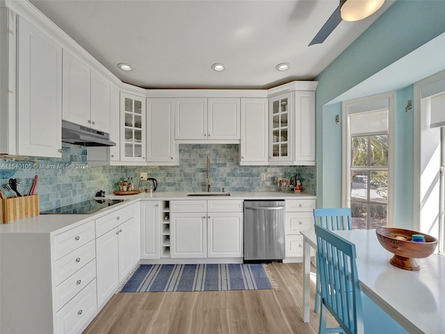 kitchen with white cabinets, stainless steel dishwasher, and black electric cooktop