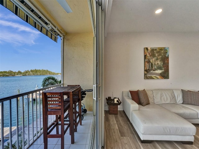 balcony featuring a water view