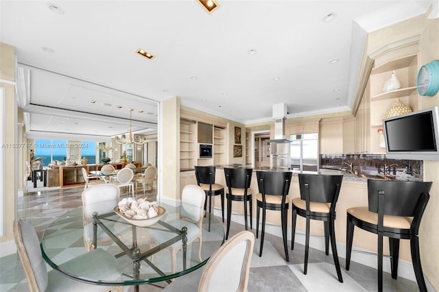 tiled dining room with a notable chandelier and crown molding