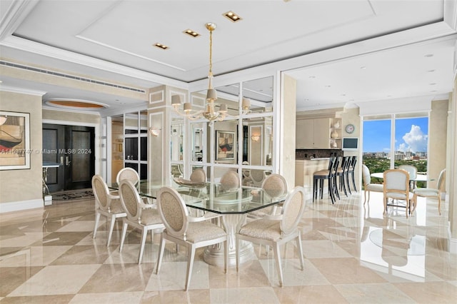 tiled dining room featuring crown molding, a tray ceiling, and an inviting chandelier