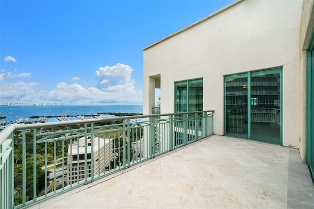 balcony featuring a water view