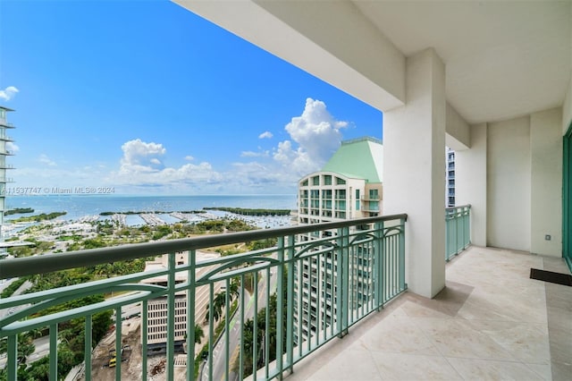 balcony featuring a water view