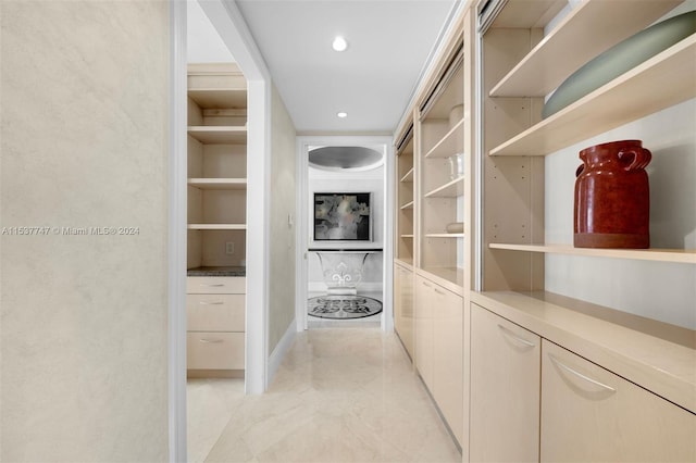 spacious closet featuring light tile floors