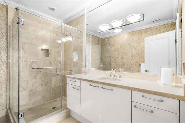 bathroom with an enclosed shower, ornamental molding, and vanity