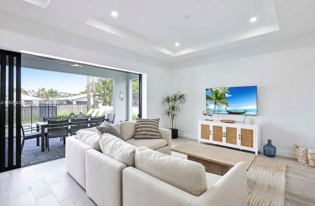 living room with a raised ceiling