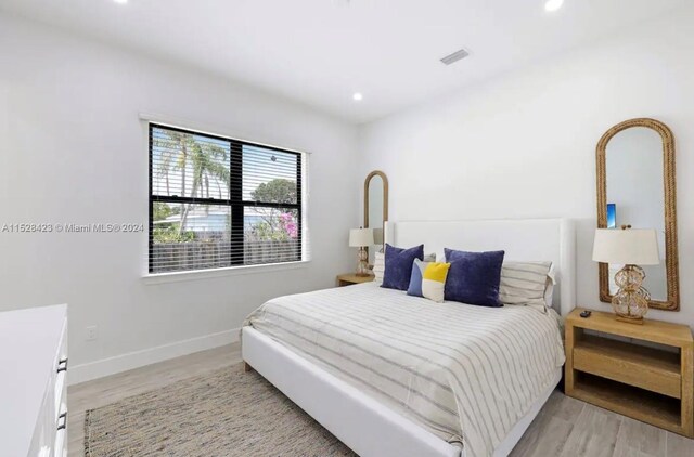 bedroom featuring light wood-type flooring