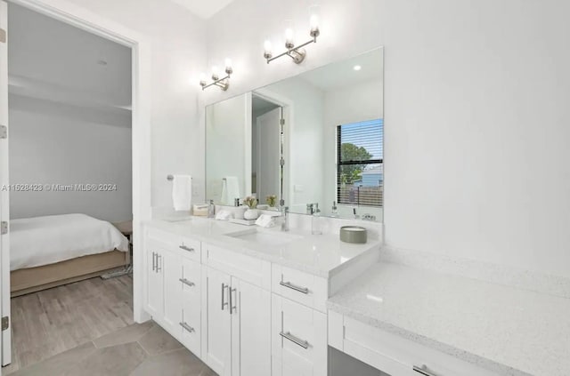 bathroom with vanity and tile flooring