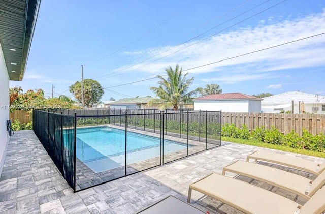 view of swimming pool with a patio area