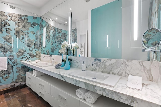 bathroom featuring tile walls and dual bowl vanity