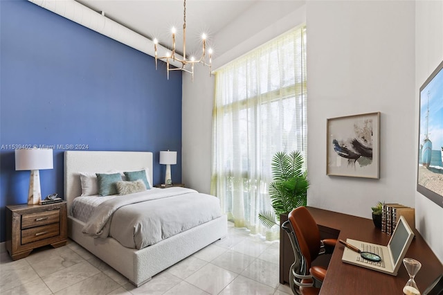 bedroom with light tile floors and a notable chandelier