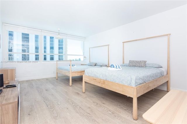 bedroom with light wood-type flooring