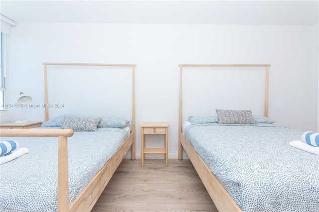 bedroom with light hardwood / wood-style floors