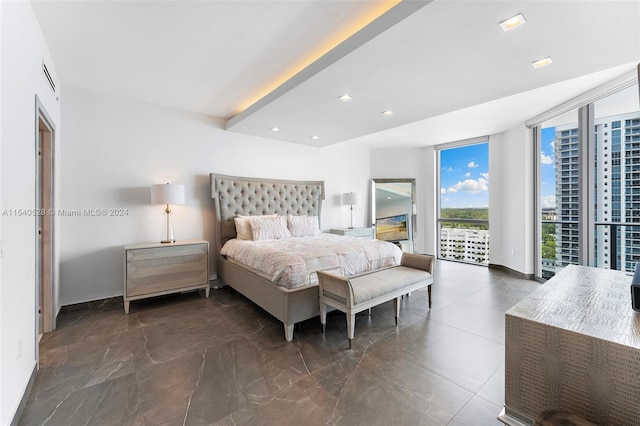 tiled bedroom featuring floor to ceiling windows and access to exterior