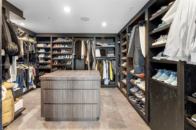 spacious closet featuring light tile floors