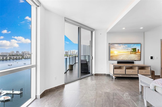 tiled living room with plenty of natural light and expansive windows