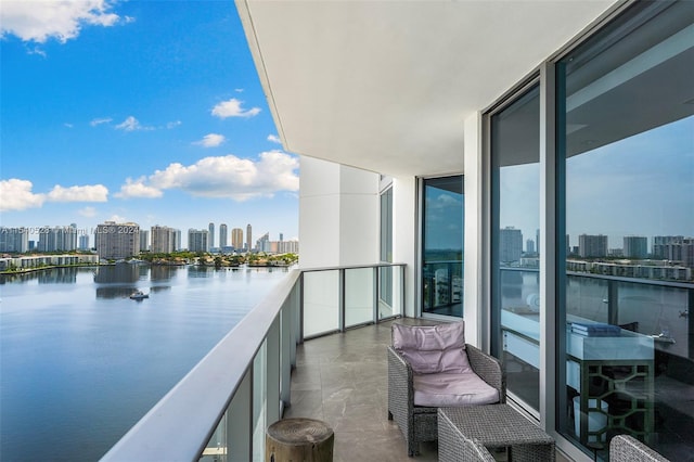 balcony featuring a water view