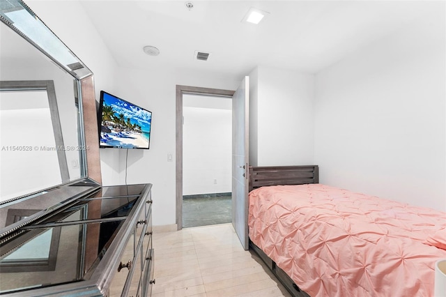 bedroom with light tile floors