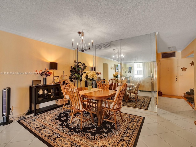 dining room featuring a chandelier, ornamental molding, light tile floors, and a textured ceiling