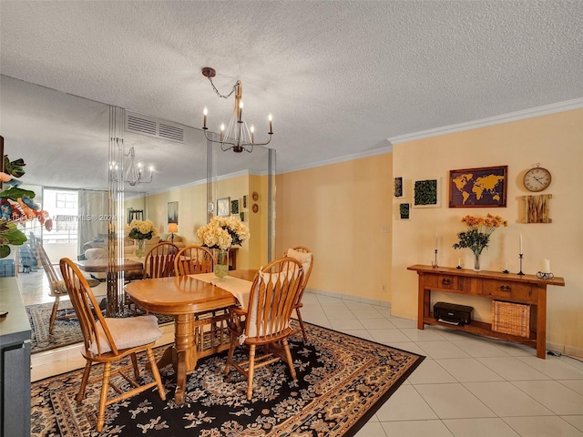 tiled dining room featuring crown molding, a textured ceiling, and a notable chandelier