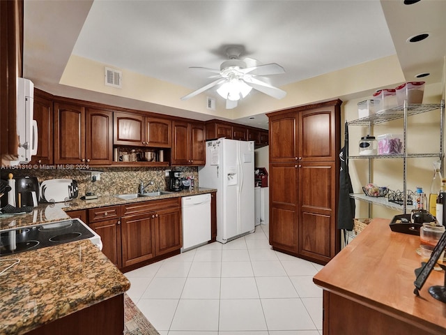 kitchen featuring ceiling fan, light tile flooring, white appliances, sink, and tasteful backsplash