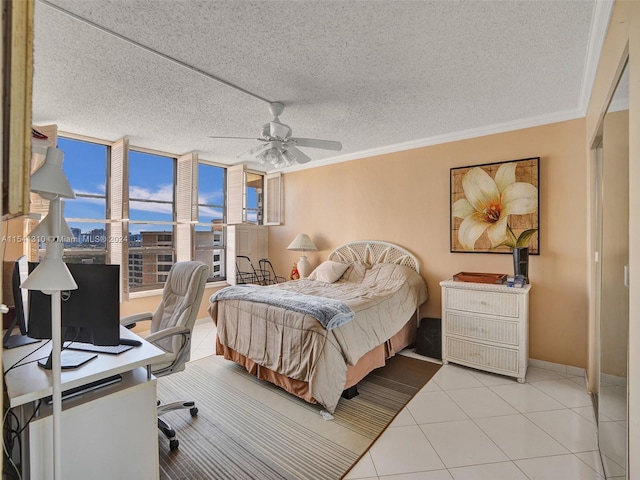 tiled bedroom with crown molding, a textured ceiling, and ceiling fan