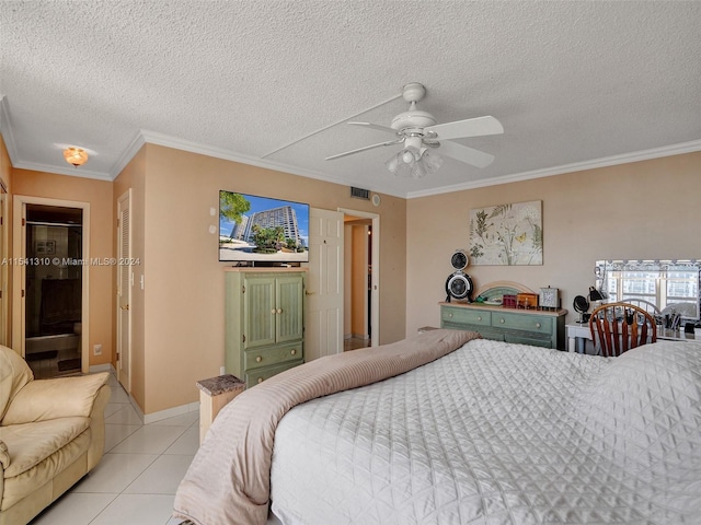 tiled bedroom featuring a textured ceiling, ceiling fan, and ornamental molding