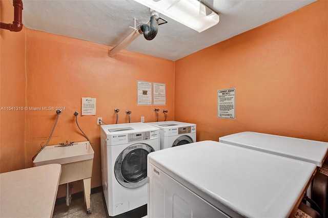 laundry area with washer hookup and washer and clothes dryer