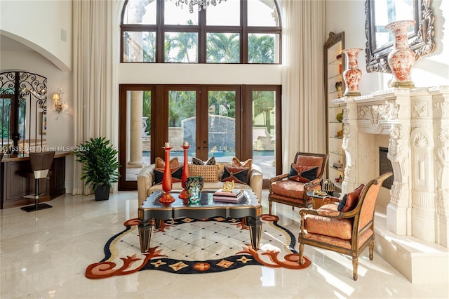 interior space with a towering ceiling and french doors