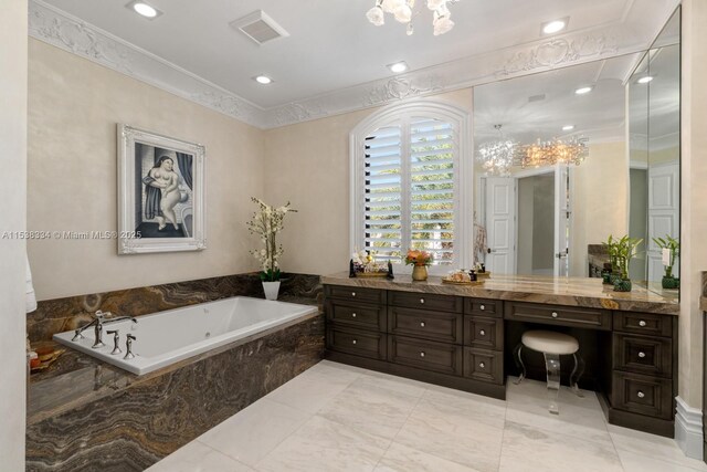 full bathroom featuring vanity, a bath, visible vents, ornamental molding, and an inviting chandelier