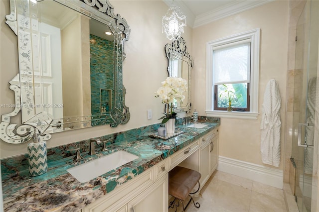 bathroom featuring tile patterned flooring, vanity, and ornamental molding