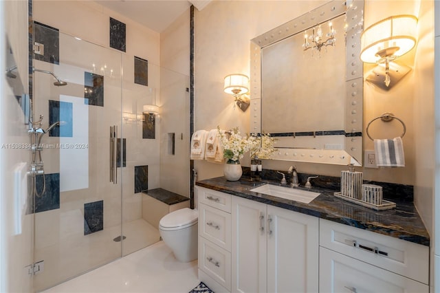 bathroom featuring vanity, toilet, and a shower with door