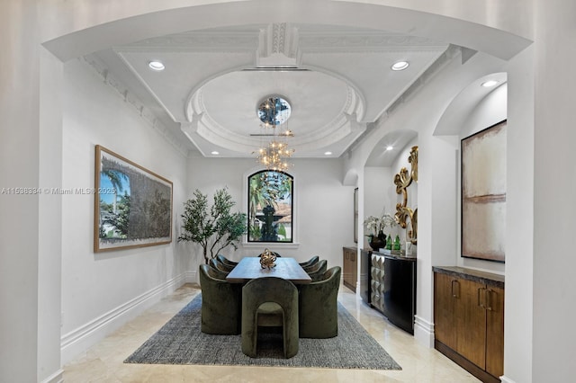 dining room featuring baseboards, a chandelier, recessed lighting, and a raised ceiling