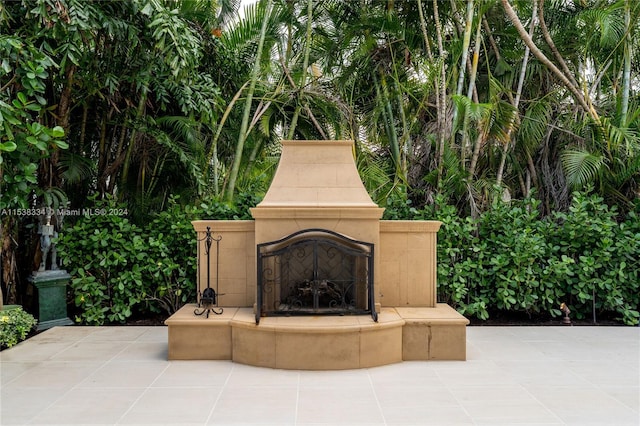 view of patio featuring a fireplace