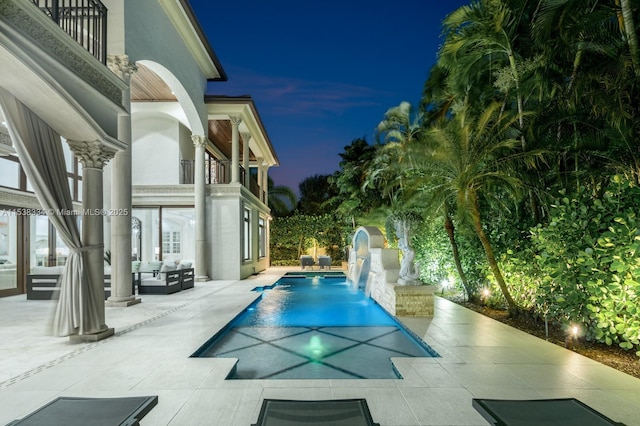 pool featuring an outdoor hangout area and a patio