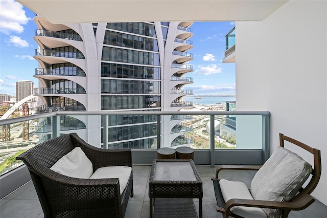 balcony featuring a water view