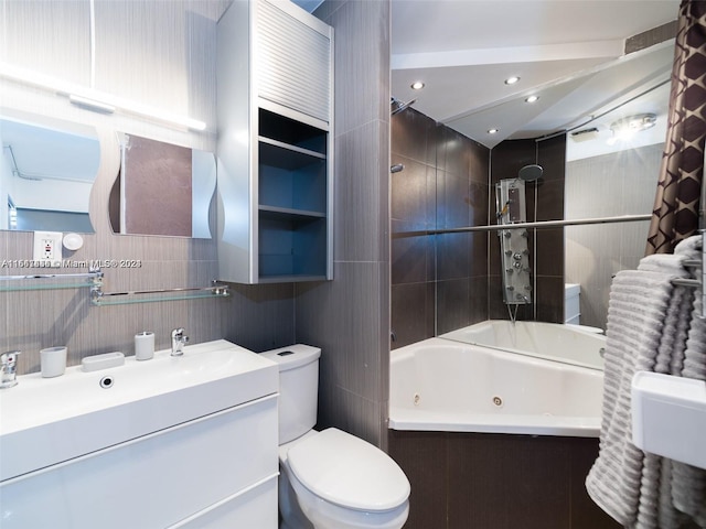 full bathroom featuring vanity, toilet, tile walls, and shower / bath combo with shower curtain