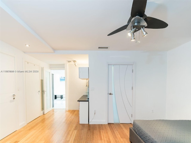 bedroom with ceiling fan and light hardwood / wood-style floors